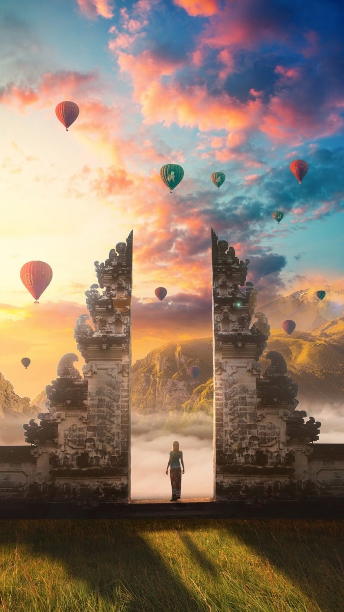 Khung cảnh cổng đá Bali lúc bình minh với khinh khí cầu bay cao, ảnh nền 1080x1920 HD, thiên nhiên tuyệt đẹp.