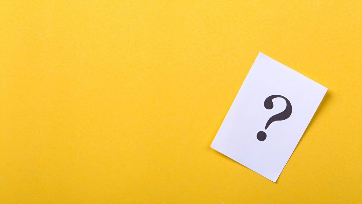 Yellow background with question mark on paper, 1080x1920, HD quality, abstract, curiosity, minimalist design.