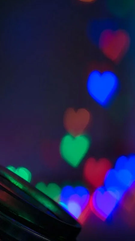 Hình nền bokeh trái tim đầy màu sắc, độ phân giải 1080x1920, chất lượng HD, tạo không gian lãng mạn.